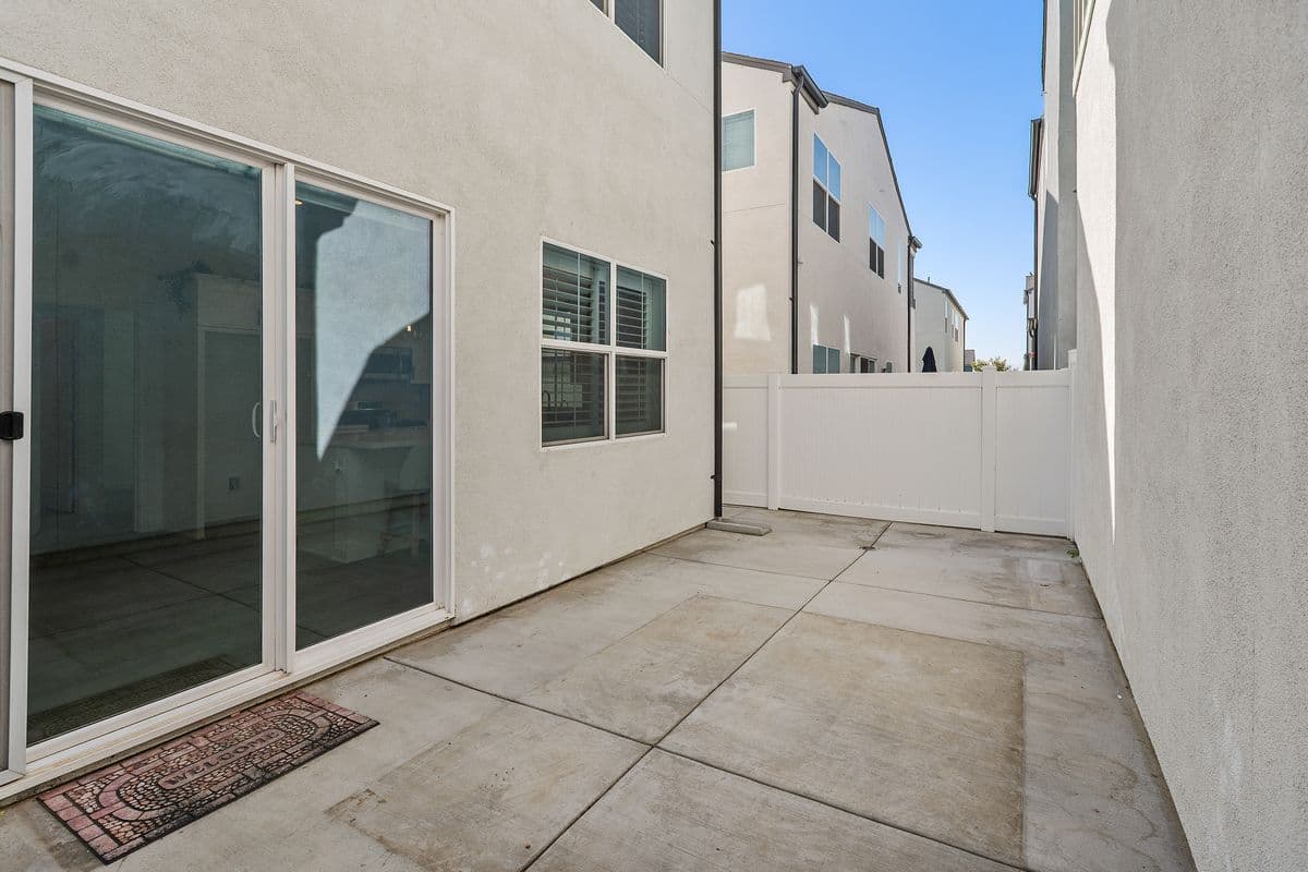 Your Private Patio from Front Gate. Side yard in the back to the left.