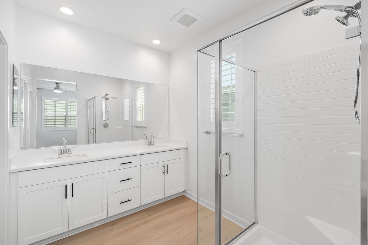 Your Top Level Primary Suite Bathroom from the doorway. Dual Sink Vanity, Huge Shower. Separate Toilet to the left as well as door to Walk-In Closet.