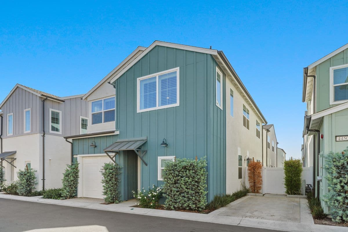 Front of your new home with the gate to your Private Patio visible.