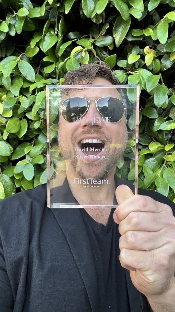 Realtor David Mercier poses with his Hall Of Fame award